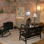 Sitting area around fireplace at Grinnell Mill Bed and Breakfast